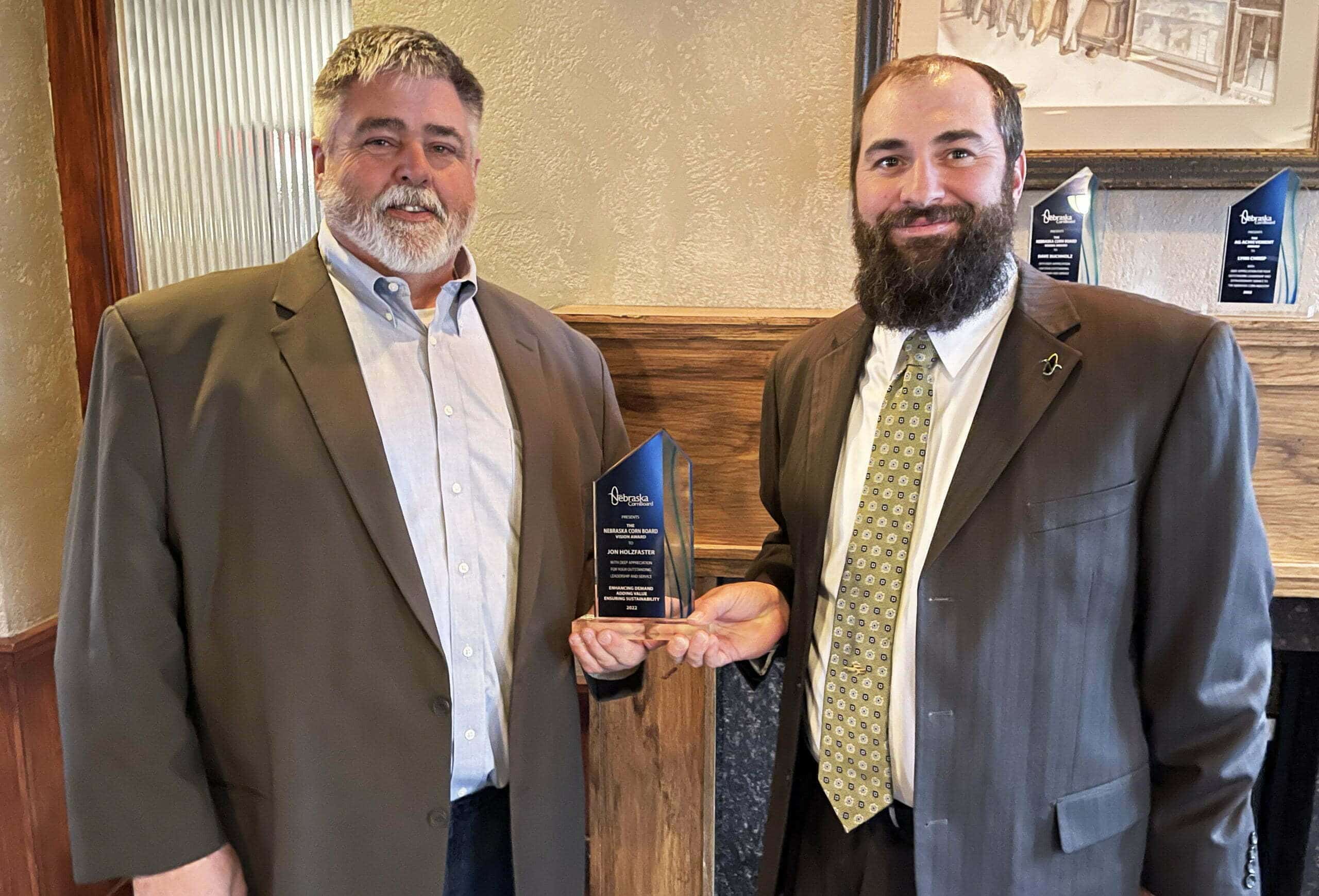 Jon Holzfaster, farmer from Paxton, accepts the Nebraska Corn Board’s Vision Award from Andy Groskopf, District 8 Director serving on the board. 