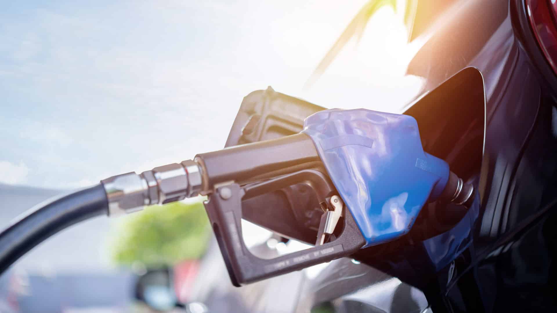 Blue handle ethanol gas pump in car