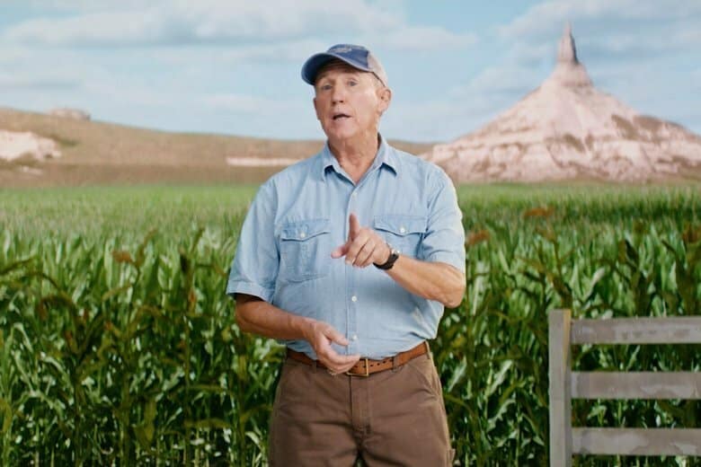 Farmer in front of a cornfield