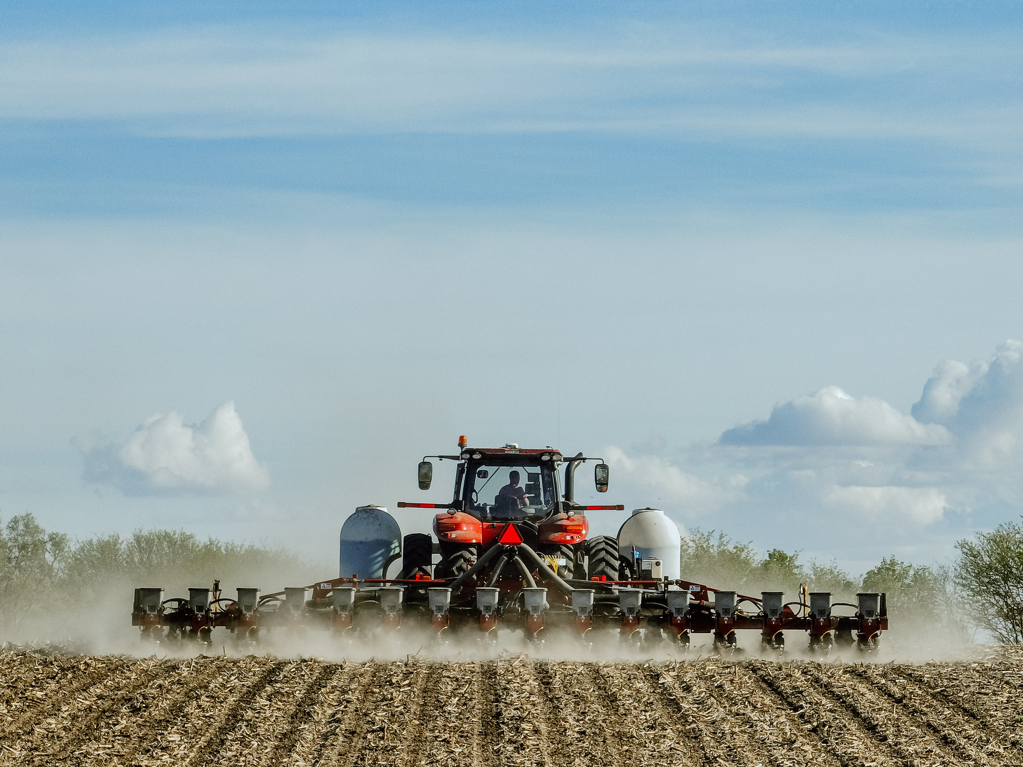 Tractor getting their field ready for corn
