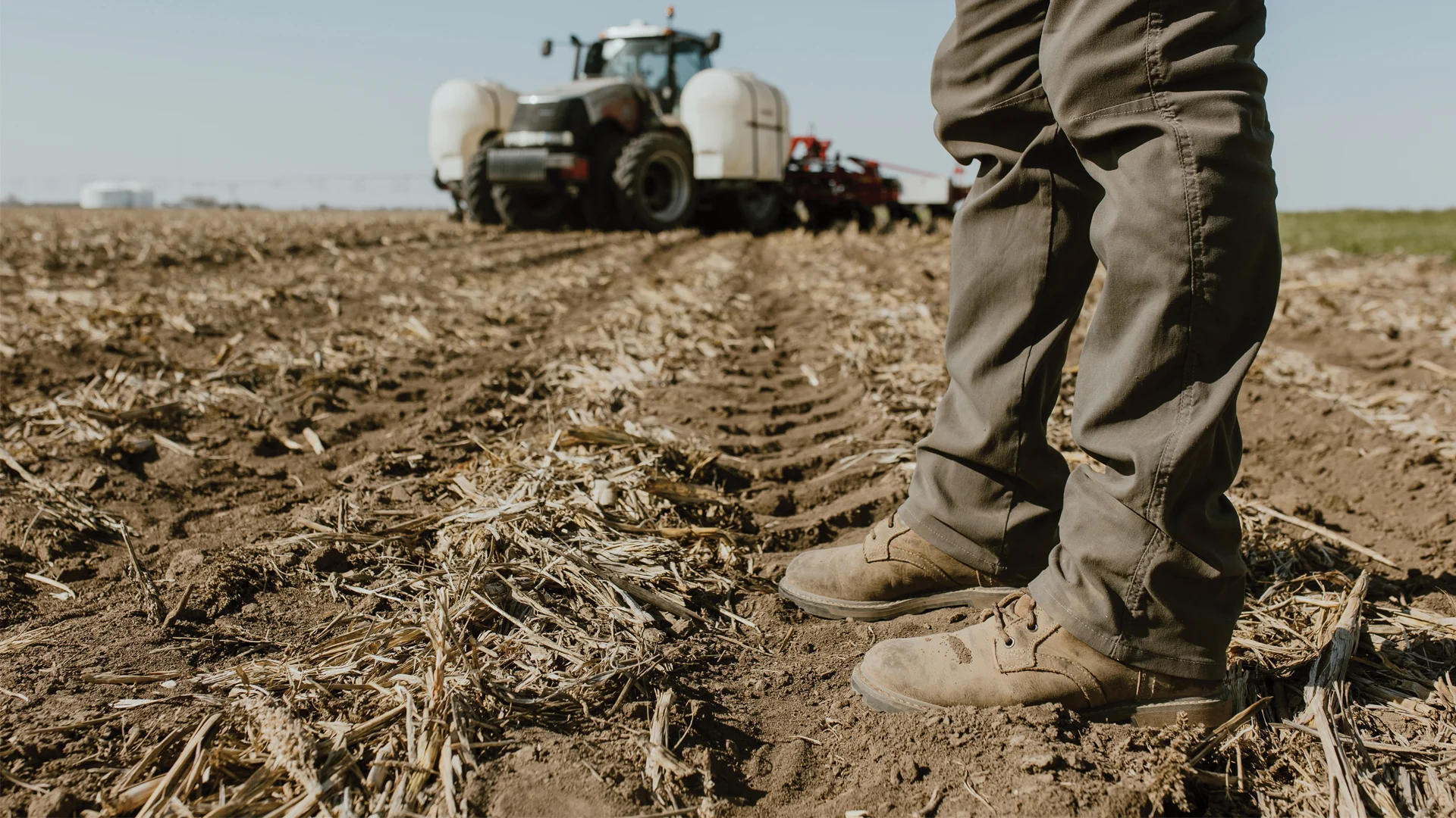 Nebraska farmers are testing new practices - Man standing on the farm.